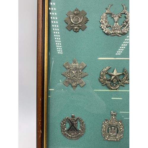 2431 - Nine framed military cap badges