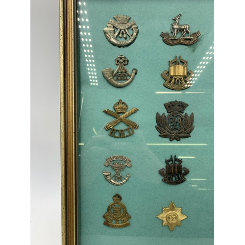 2433 - Fifteen framed military cap badges