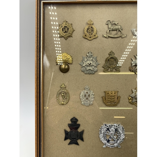 2435 - Eighteen framed military cap badges