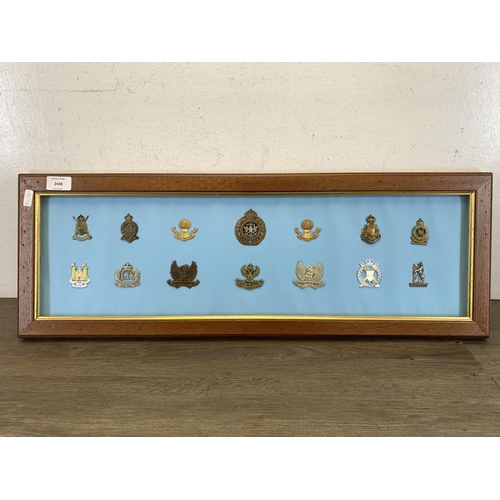 2436 - Fourteen framed Yeomanry military cap badges