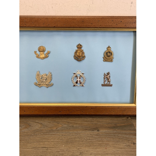 2436 - Fourteen framed Yeomanry military cap badges