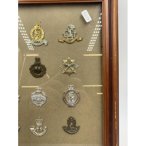 2437 - Twelve framed military cap badges