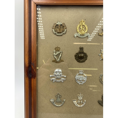 2437 - Twelve framed military cap badges