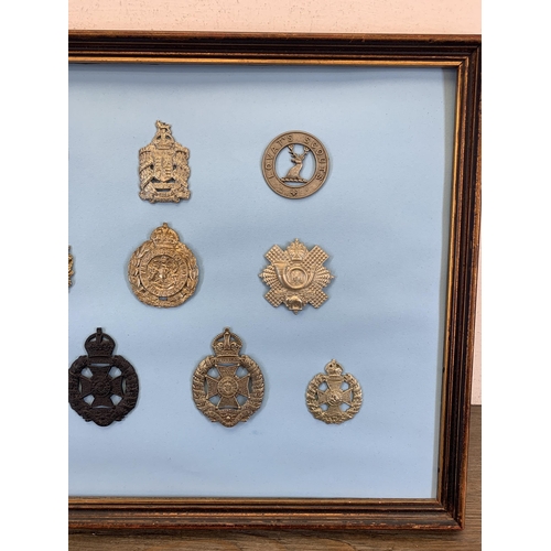 2438 - Ten framed military cap badges