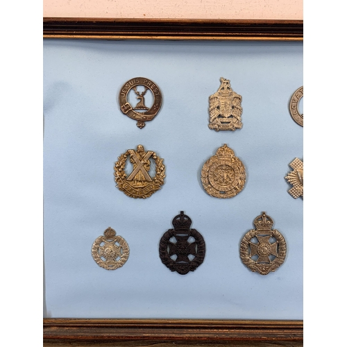 2438 - Ten framed military cap badges