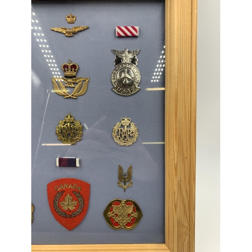 2439 - Eleven framed Air Force Associated military cap badges