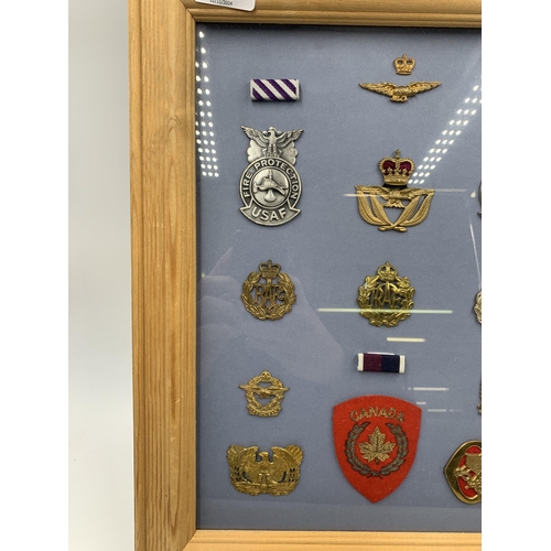 2439 - Eleven framed Air Force Associated military cap badges