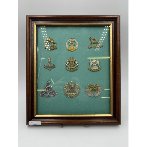 2440 - Nine framed Scottish Regiment military cap badges