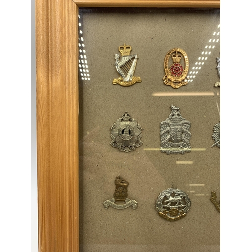 2442 - Nine framed military cap badges