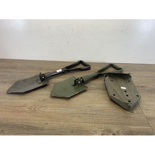 2443 - Two military folding shovels with one in original case - marked J.G.96