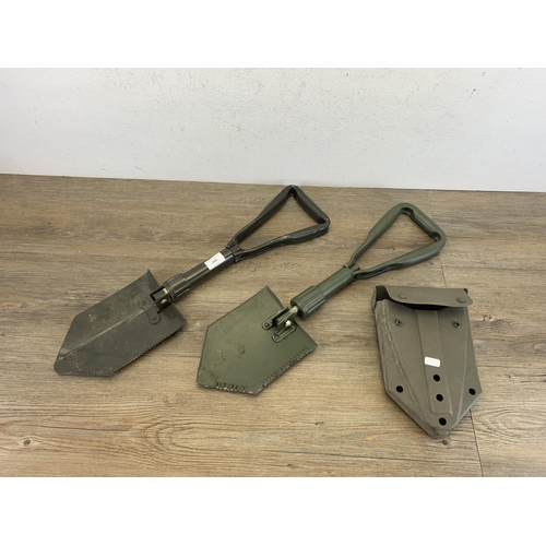 2443 - Two military folding shovels with one in original case - marked J.G.96