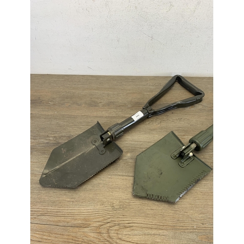 2443 - Two military folding shovels with one in original case - marked J.G.96