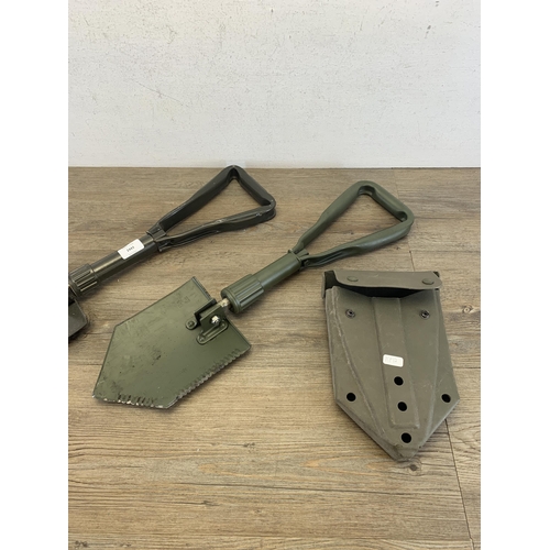 2443 - Two military folding shovels with one in original case - marked J.G.96