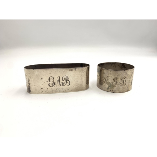 2383 - Two hallmarked Birmingham silver napkin rings, one 	James Deakin & Sons, dated 1963 and one James Wo... 