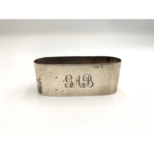 2383 - Two hallmarked Birmingham silver napkin rings, one 	James Deakin & Sons, dated 1963 and one James Wo... 