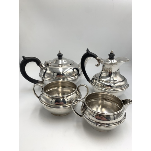 2386 - An Edwardian S W Smith & Co hallmarked Birmingham silver three piece tea set, dated 1910, comprising...