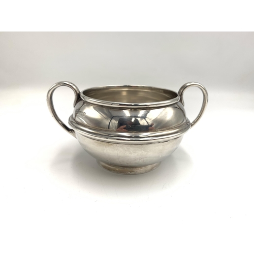 2386 - An Edwardian S W Smith & Co hallmarked Birmingham silver three piece tea set, dated 1910, comprising... 