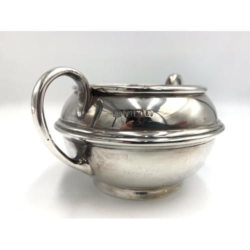 2386 - An Edwardian S W Smith & Co hallmarked Birmingham silver three piece tea set, dated 1910, comprising... 