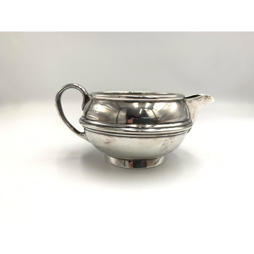 2386 - An Edwardian S W Smith & Co hallmarked Birmingham silver three piece tea set, dated 1910, comprising... 