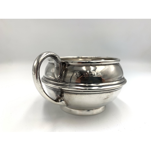 2386 - An Edwardian S W Smith & Co hallmarked Birmingham silver three piece tea set, dated 1910, comprising... 