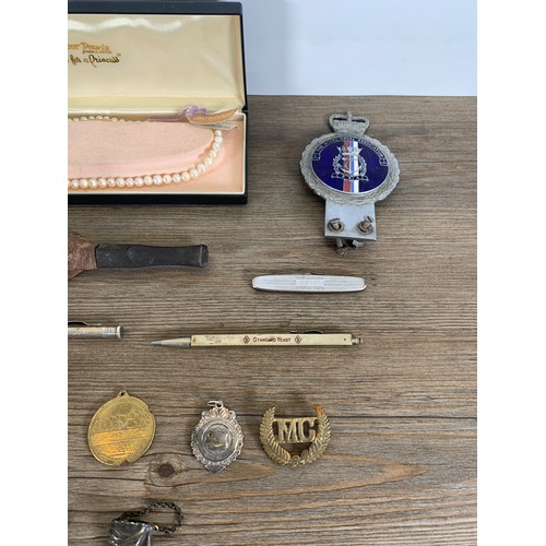 2390 - A collection of items to include silver plated snuff box, Engineer Lensatic compass, carved wooden n... 