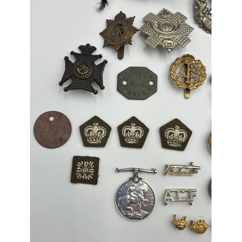 2448 - A collection of mostly militaria to include WWI British War medal presented to 38911 Pte. J. Turley ... 