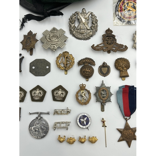 2448 - A collection of mostly militaria to include WWI British War medal presented to 38911 Pte. J. Turley ... 