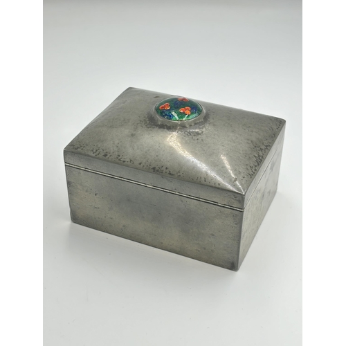 2456 - A pewter cigarette box with enamel roundel and wooden lining, inscribed '0851 English pewter' in the... 