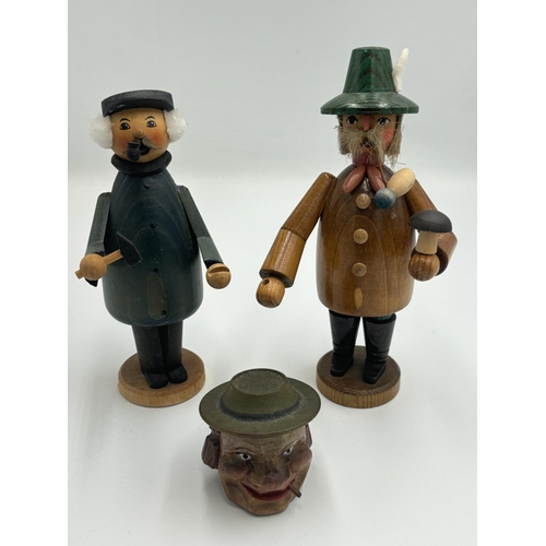 2459 - Three Black Forest hand painted and carved wooden items, two figurines and one bottle stop - largest... 