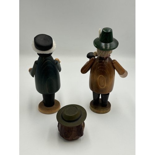 2459 - Three Black Forest hand painted and carved wooden items, two figurines and one bottle stop - largest... 