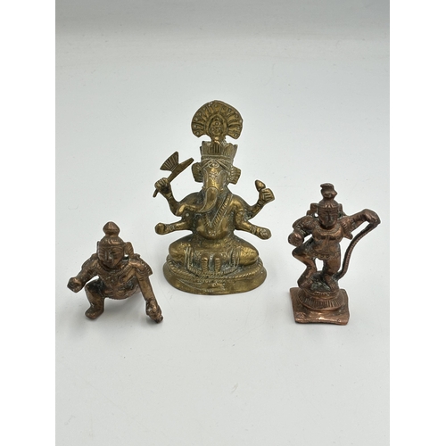 2462 - Three Hindu deity figurines, one brass and two copper - largest approx. 8.5cm