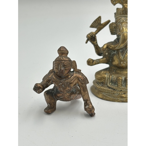 2462 - Three Hindu deity figurines, one brass and two copper - largest approx. 8.5cm