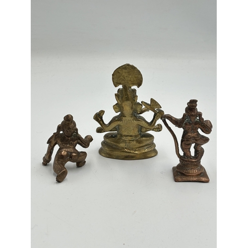 2462 - Three Hindu deity figurines, one brass and two copper - largest approx. 8.5cm