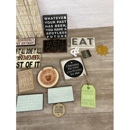 565 - A collection of vintage style wooden wall hanging signs