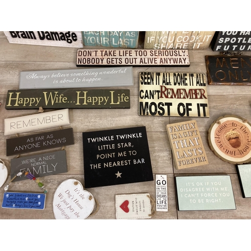 565 - A collection of vintage style wooden wall hanging signs