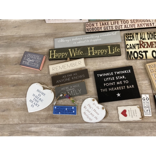 565 - A collection of vintage style wooden wall hanging signs