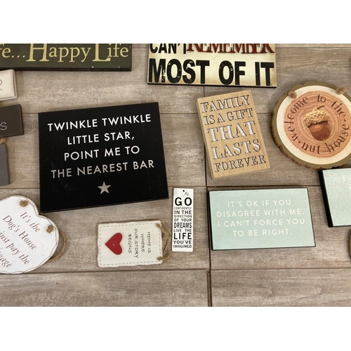 565 - A collection of vintage style wooden wall hanging signs