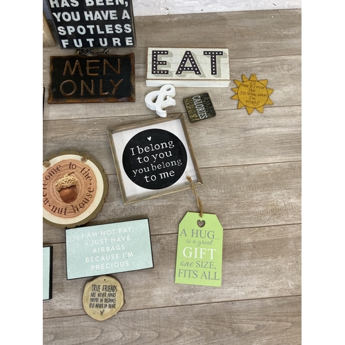 565 - A collection of vintage style wooden wall hanging signs