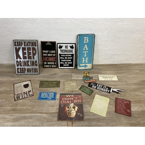 566 - A collection of vintage style metal wall hanging signs