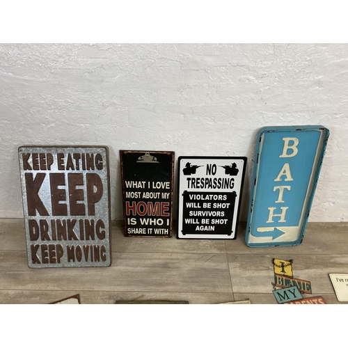 566 - A collection of vintage style metal wall hanging signs