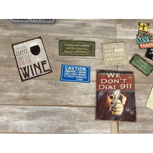 566 - A collection of vintage style metal wall hanging signs