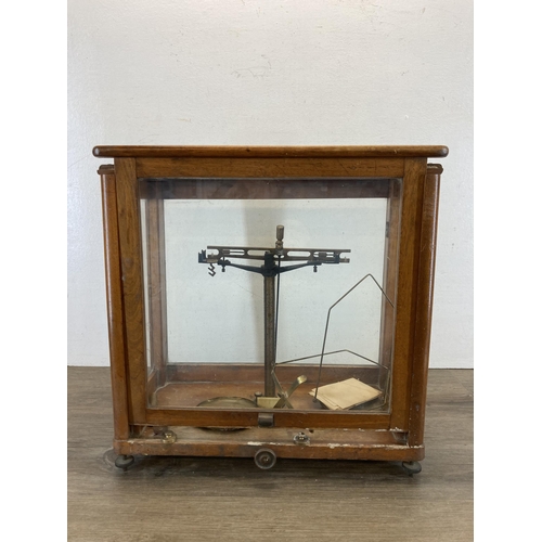 568 - A set of early/mid 20th century scientific precision weighing scales