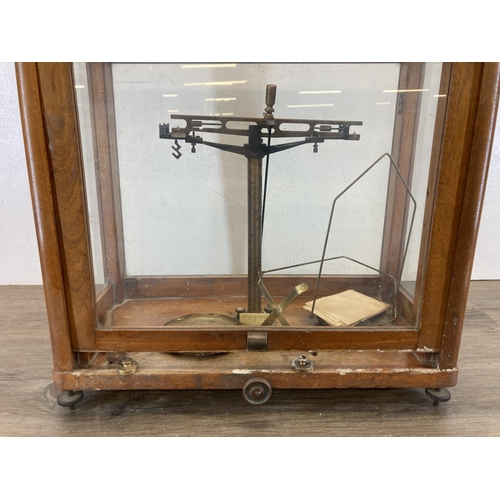 568 - A set of early/mid 20th century scientific precision weighing scales