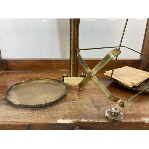 568 - A set of early/mid 20th century scientific precision weighing scales