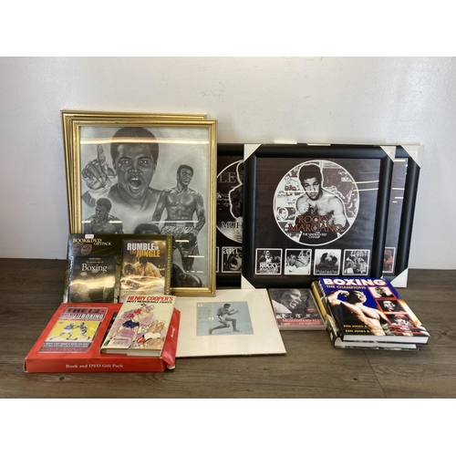 558 - A collection of boxing ephemera to include hardback books, framed prints of Muhammad Ali, Mike Tyson... 