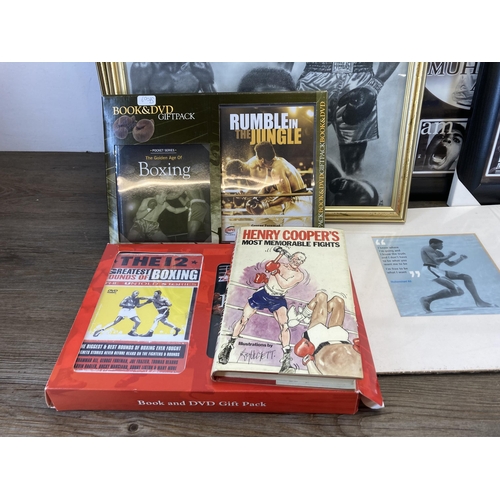 558 - A collection of boxing ephemera to include hardback books, framed prints of Muhammad Ali, Mike Tyson... 