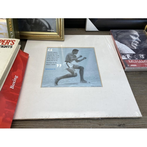 558 - A collection of boxing ephemera to include hardback books, framed prints of Muhammad Ali, Mike Tyson... 