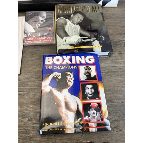 558 - A collection of boxing ephemera to include hardback books, framed prints of Muhammad Ali, Mike Tyson... 