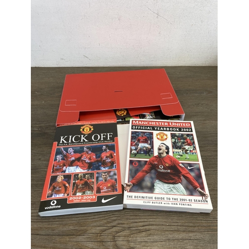 559 - A collection of Manchester United memorabilia comprising membership packs, magazines, year books and... 