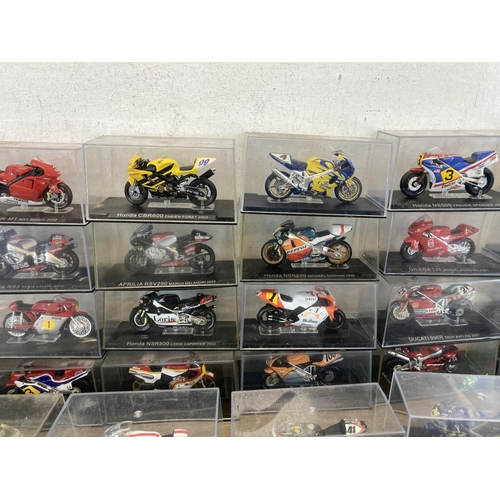 513 - A large collection of boxed motorcycle diecast model vehicles